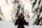 portrait of man in black jacket with ski tour equipment.