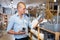 Portrait of man choosing deodorant in dishware store