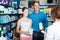 Portrait of man with daughter teenager shopping medicine in drug