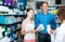 Portrait of man with daughter teenager shopping medicine in drug