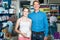 portrait of man with daughter teenager shopping medicine in drug store