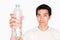 Portrait of a man drinking purified water from bottle on white background. purified water is good for health to protect people