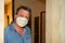 Portrait man with face fabric mask homemade in home quarantine lockdown covid-19 coronavirus pandemic contagious disease