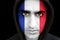 Portrait of a man with french flag face paint