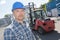 Portrait man in front forklift