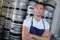 Portrait man in front kegs beer