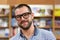 Portrait of a man with glasses in a bookstore