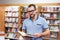 Portrait of a man with glasses in a bookstore