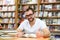 Portrait of a man with glasses in a bookstore