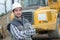 Portrait man with heavy plant vehicle