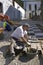 Portrait of man laying new sidewalk, Spain