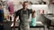 Portrait of a man: a male artisan sculptor looks at the camera against the backdrop of a workshop, tools and products