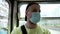 Portrait of a man in a medical mask who rides in public transport.