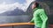 Portrait of Man in New Zealand Milford Sound tourist on travel on Cruise ship in Fiordland National Park. Man enjoying