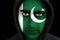 Portrait of a man with Pakistani flag face paint