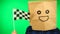 Portrait of man with paper bag on head waving Checkered race flag with smiling face against green background.