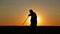 Portrait of a man with a sword at sunset, the path of a warrior. Samurai yakuza with a sword at sunset of the day.