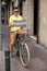 Portrait of a man tourist hipster standing with map and bicycle in europe city center of Barcelona.Traveling in Spain