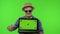 Portrait of man tourist in sunglasses showing laptop. Thumbs up. Chroma key