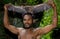 Portrait of a man of the tribe Yaffi after hunting flying foxes. New Guinea Island