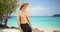 Portrait of man wearing swim shorts on St. John island beach.