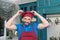 Portrait of man wears cap at kitchen. Guy loves hat and cooking.Bearded chef dressed on the red hat.