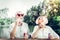 Portrait of man and wife engaging in blowing bubbles outdoors