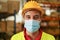 Portrait of man worker inside warehouse wearing safety mask for coronavirus prevention - Logistic and Industry concept - Focus on