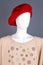 Portrait of mannequin in red french beret.
