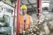 Portrait of manual worker pulling hand truck with steel shavings in factory