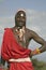 Portrait of Masai Warrior in traditional red toga and beads at Lewa Wildlife Conservancy in North Kenya, Africa