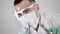 Portrait of masked dentist specialist with dental tool and syringe in hands pov