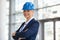 Portrait of mature architect with hardhat at construction site