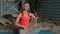 Portrait of mature blond woman, who is sitting in lotus pose during meditation outside.