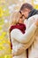 Portrait of Mature couple enjoying autumn while  showing affection in park