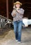 Portrait of mature farm owner in cowshed