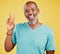 Portrait of a mature friendly african american man looking happy and smiling while making an peace gesture with his hand