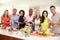 Portrait Of Mature Friends Enjoying Dinner Party At Home