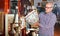 Portrait of mature man choosing vintage goods at antiques shop