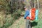 portrait of a mature traveler with a backpack in the taiga