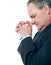Portrait of matured businessman praying