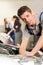 Portrait of mechanic repairing car