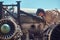 Portrait of a mechanic in uniform and flying helmet, repairing the dismantled airplane turbine in an open-air museum.