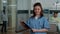 Portrait of medical assistant with checkup documents