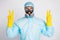 Portrait of medical man worker make v-sign wear white biohazard uniform breathing mask isolated over gray color