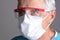 Portrait of a medical professional wearing scruba and Personal Protective Equipment, PPE. Closeup Head only