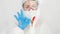 Portrait of medical worker or doctor protecting with suit and mask from covid-19 showing OK sign with fingers. Global