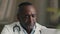 Portrait medical worker mature 50s man african american doctor general practitioner work at hospital office using modern