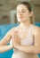 Portrait of meditating young smiling woman