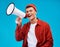 Portrait, megaphone and man with a smile, equality and promotion with a speech on a blue background. Person, activist